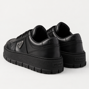 [color:Noir intégral] Prada — Sneakers à semelle épaisse | 3/4 arrière