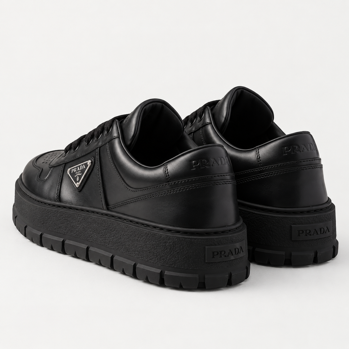 [color:Noir intégral] Prada — Sneakers à semelle épaisse | 3/4 arrière