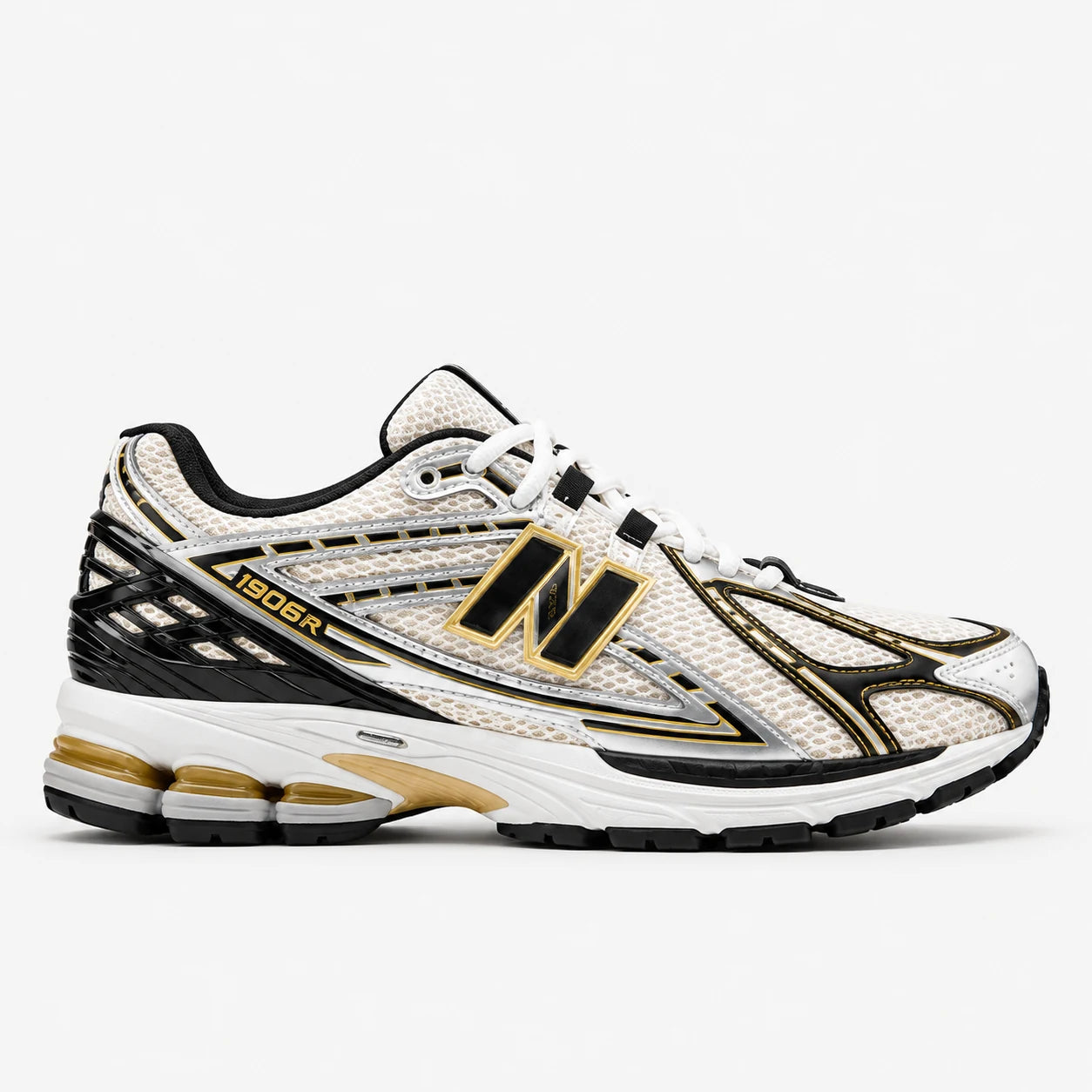New Balance 1906R Argent-or — 3/4 avant